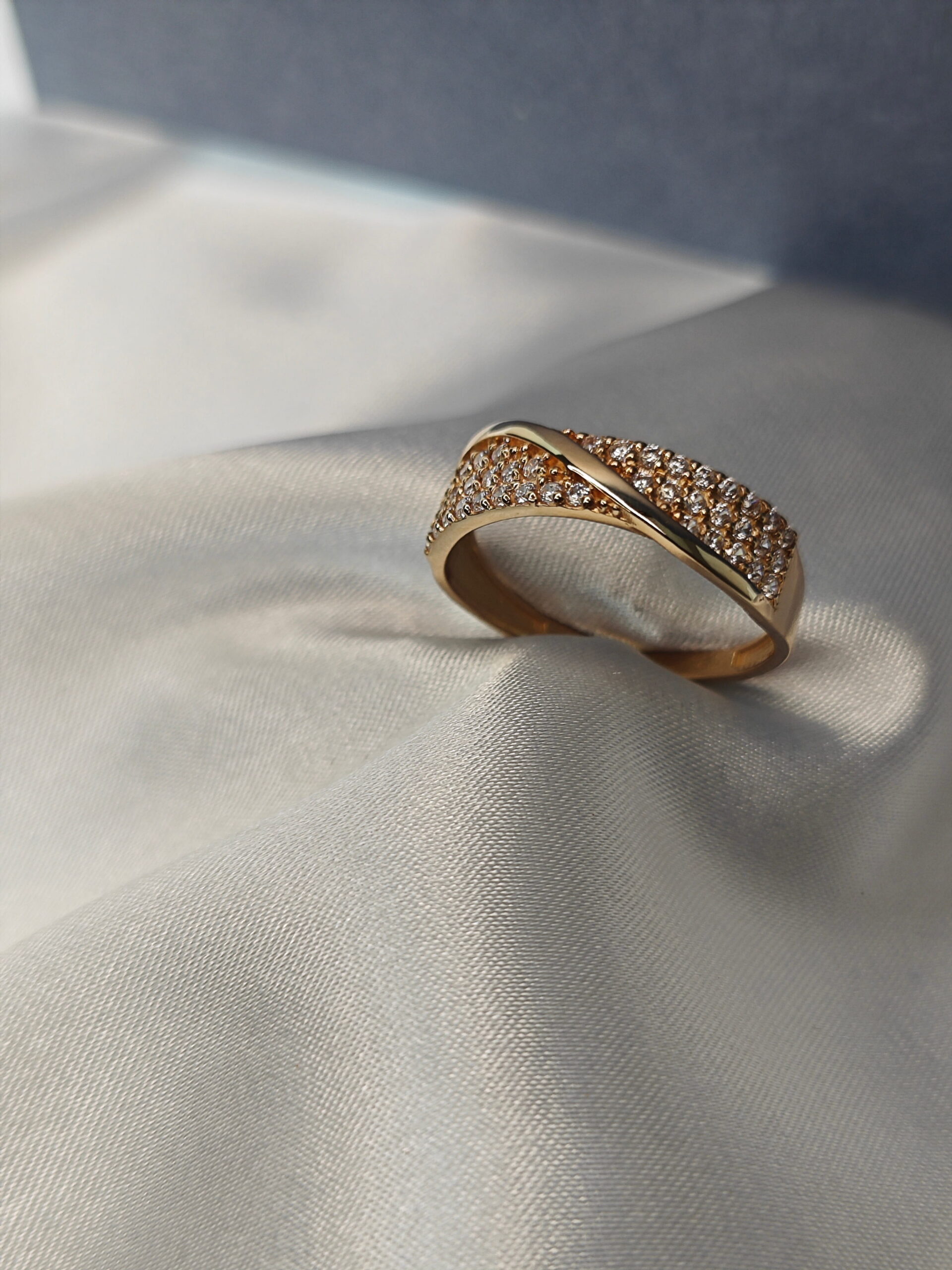 wedding rings
 laid on top of white flowers